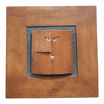 Minimalist ceramic face wall art in deep orange